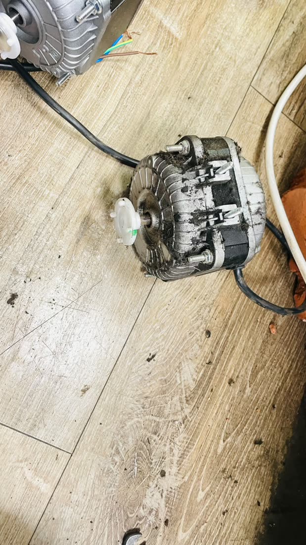 Compressor, motor and fan assembly during a repair job